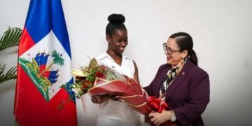 Raina Forbin receives the Haitian winner of the Eloquentia 2026 competition